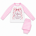 Pink stripe long pyjamas with a pink bow, moon and stars, personalised Ella’s Sleepover Night, on a white background.