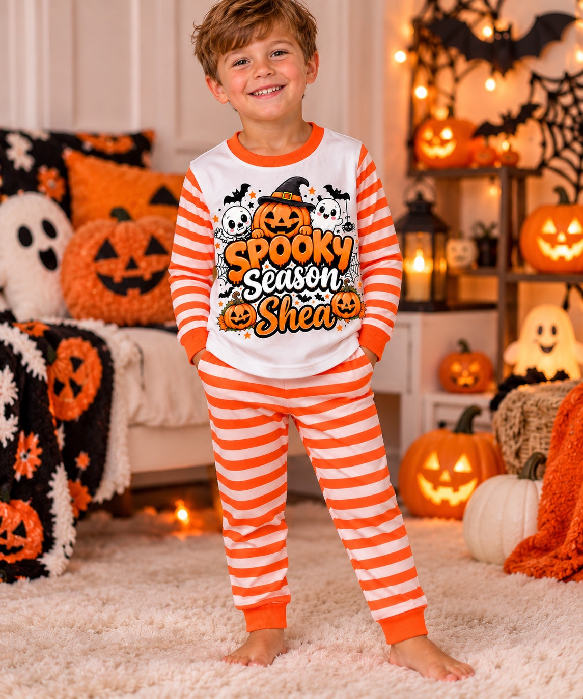 Boy wearing personalised orange stripe Spooky Season pyjamas
